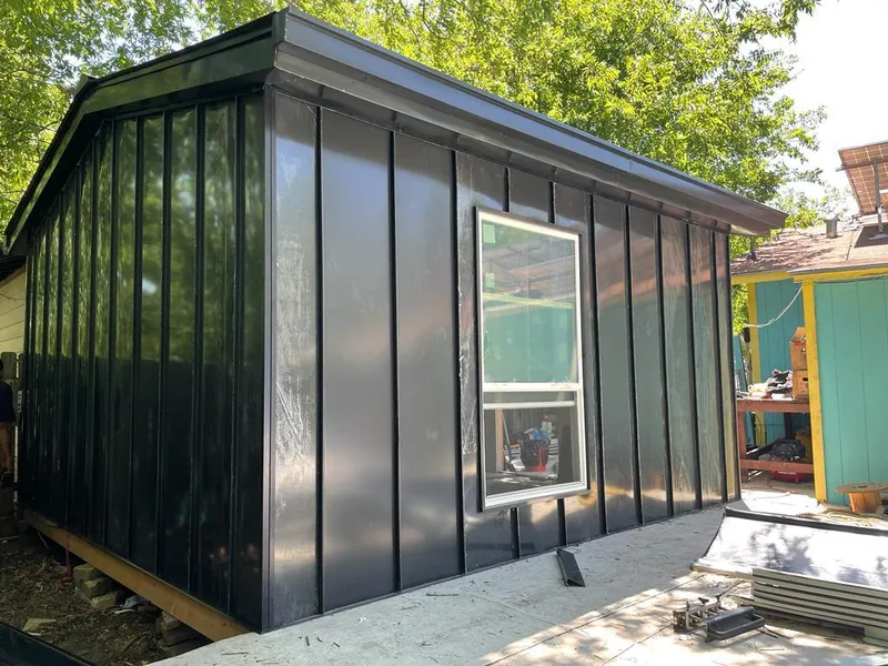 Black standing seam metal wall panels for Roof Inspection in Elmwood