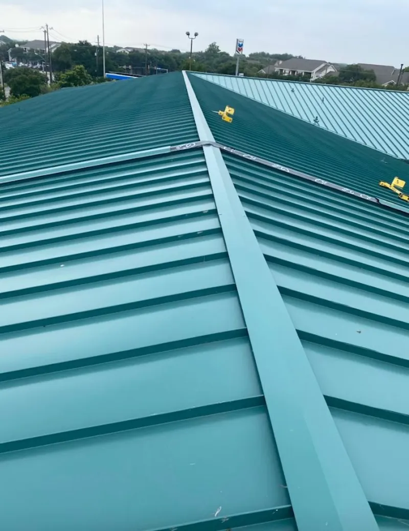 Green commercial metal roof ridge and valley for Metal Roof Repair in Elmwood