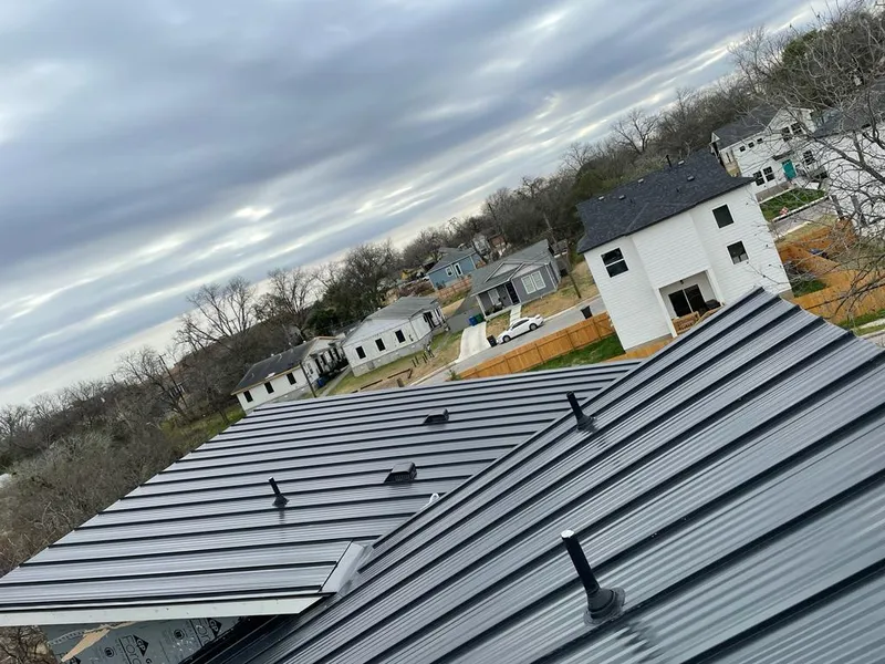 Standing seam metal roof panels with vents for Skylight Repair in Elmwood
